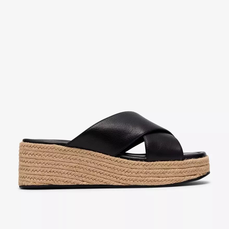 Mules Tessiah pour femme, compensées en cuir noir Mules Tessiah pour femme, compensées en cuir noir