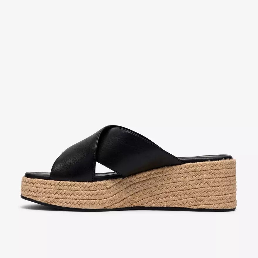 Mules Tessiah pour femme, compensées en cuir noir Mules Tessiah pour femme, compensées en cuir noir