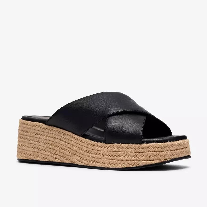 Mules Tessiah pour femme, compensées en cuir noir Mules Tessiah pour femme, compensées en cuir noir