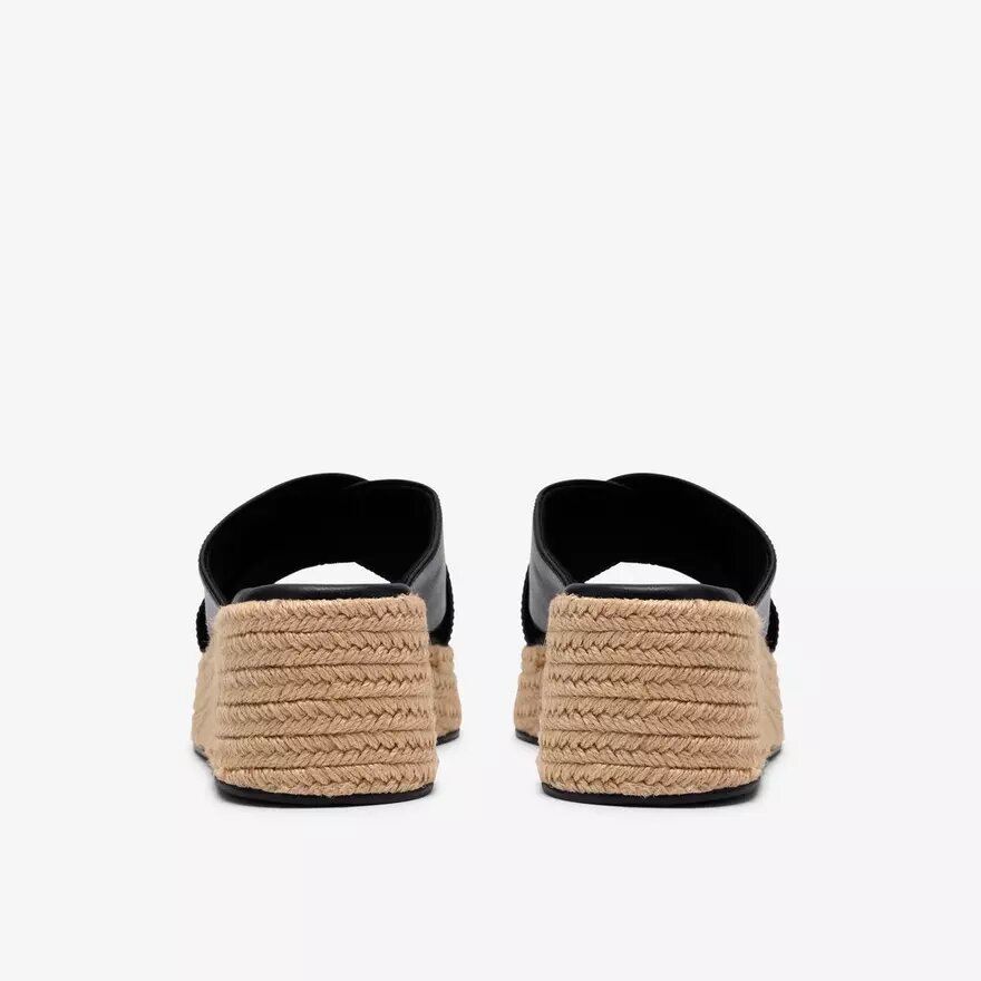 Mules Tessiah pour femme, compensées en cuir noir Mules Tessiah pour femme, compensées en cuir noir